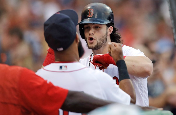 Boston Red Sox's Andrew Benintendi, right, celebrates with Chris Young after his solo home run off Cleveland Indians starting pitcher Trevor Bauer during the third inning Monday. Benintendi's stats since the All-Star break are comparable to Yankees' phenom Aaron Judge.