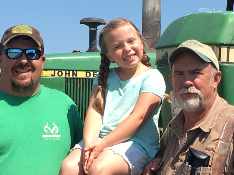 Thomas is a true family farm. From left, Paul Thomas, his daughter Taylar, 6, and his dad, Frank.