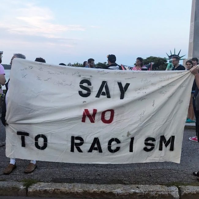 People turn out at Portland's Eastern Promenade on Saturday evening to stand in solidarity with the victims of the violence in Charlottesville, Va. Earlier Saturday, a car plowed into a crowd after white supremacists and counterprotesters clashed. 