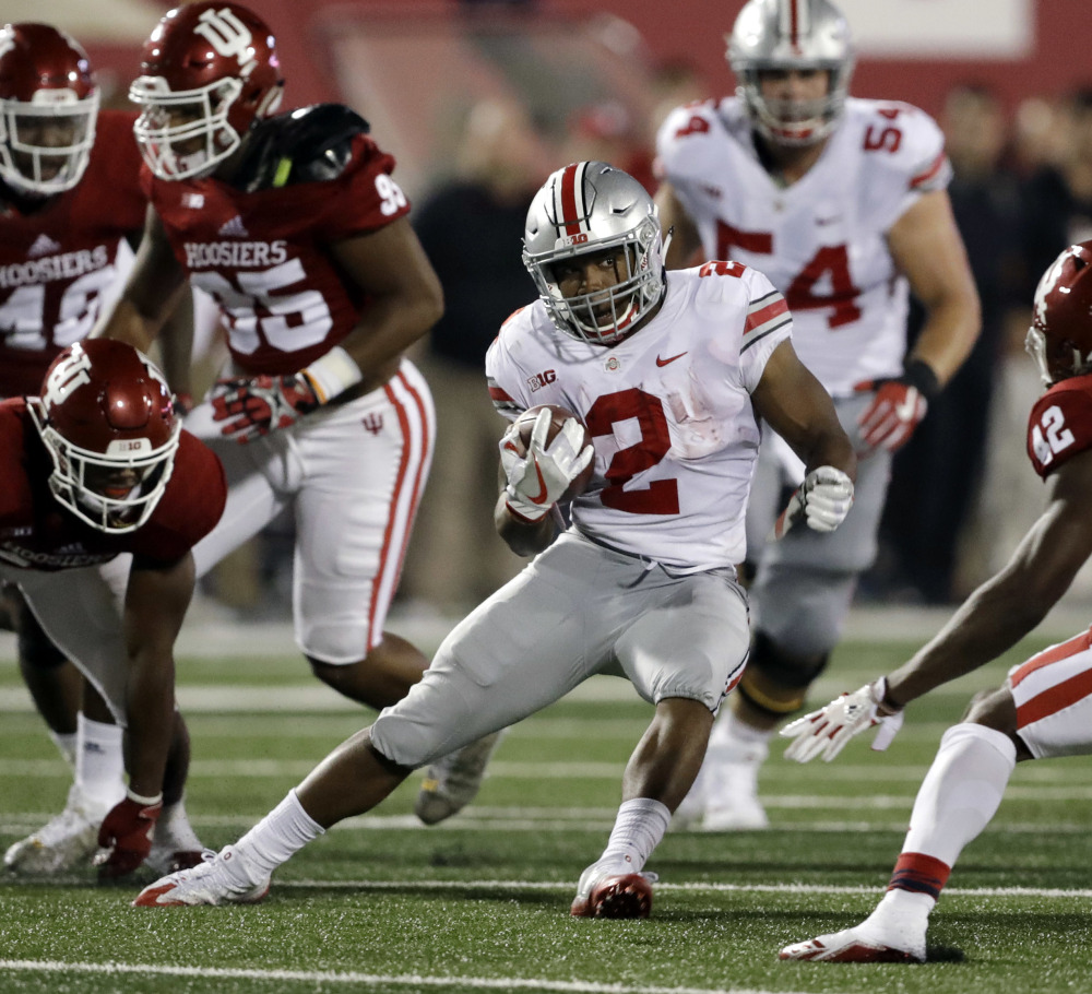 Ohio State's J.K. Dobbins carries against Indiana during the Buckeyes' 49-21 season-opening road victory Thursday night. The freshman ran for 181 yards and could challenge last year's top runner, Mike Weber, for playing time.
