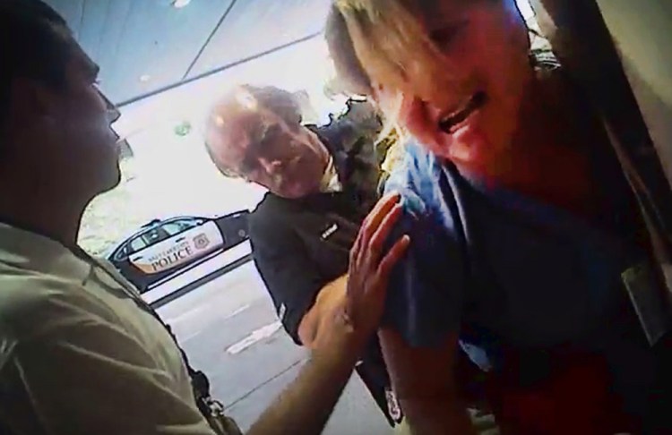 In this July 26 frame grab from a police body camera, nurse Alex Wubbels is handcuffed by a Salt Lake City police officer at University Hospital in Salt Lake City.