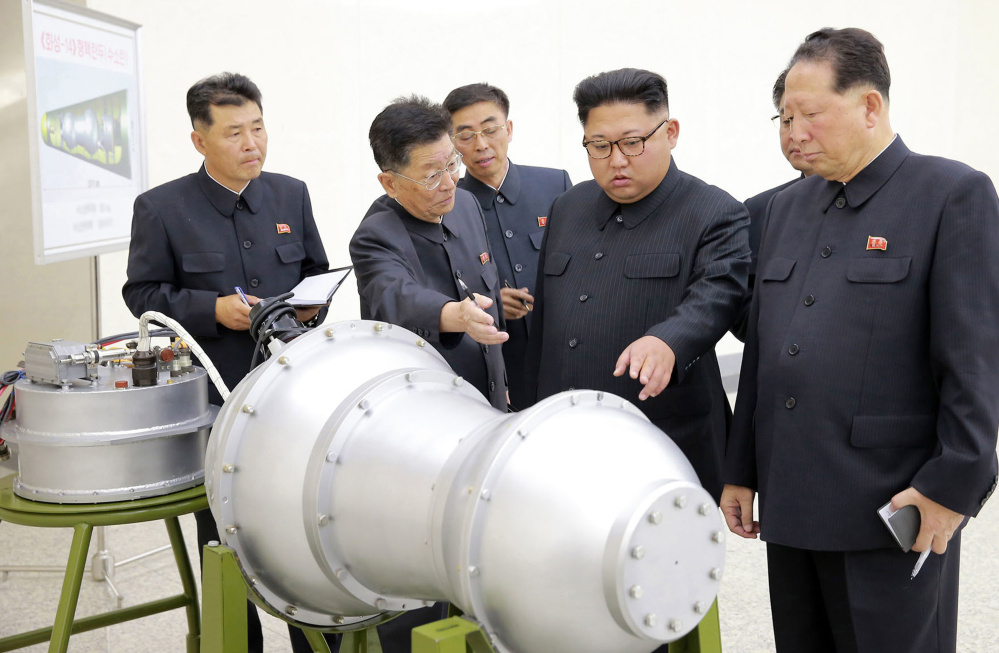 North Korea released this photo on Sunday of leader Kim Jong Un inspecting what it said is a hydrogen bomb that could be loaded onto a ballistic missile.