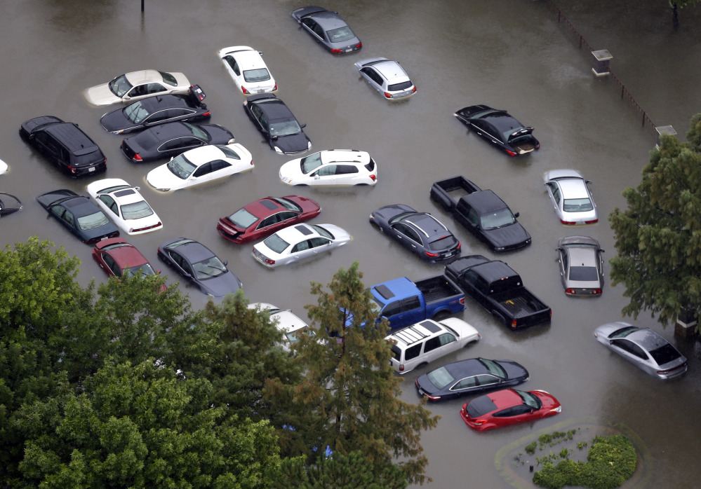 Dozens of flooded vehicles near Houston's Addicks Reservoir may likely never be fit to drive again. Hundreds of thousands of cars, vans and trucks have been flooded in driveways, parking lots and dealerships, creating a demand that could raise prices.