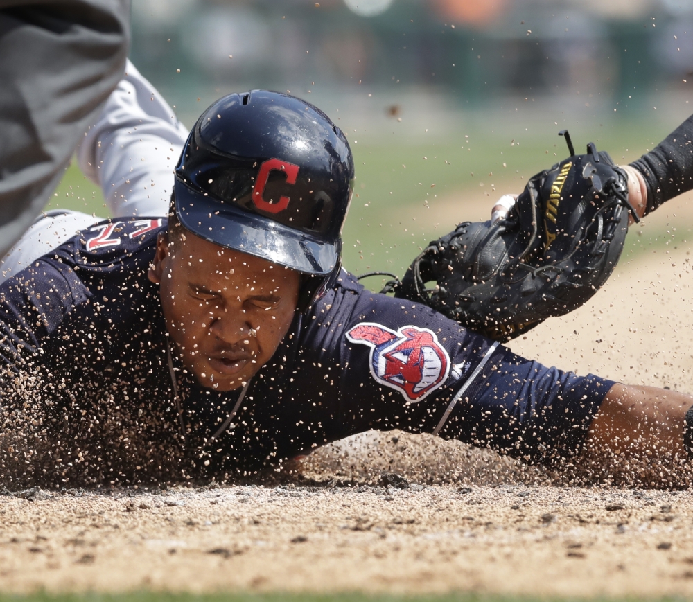 Cleveland's Jose Ramirez beats the tag of Detroit catcher James McCann in the third inning Sunday. Ramirez had five extra base hits and the Indians won 11-1.