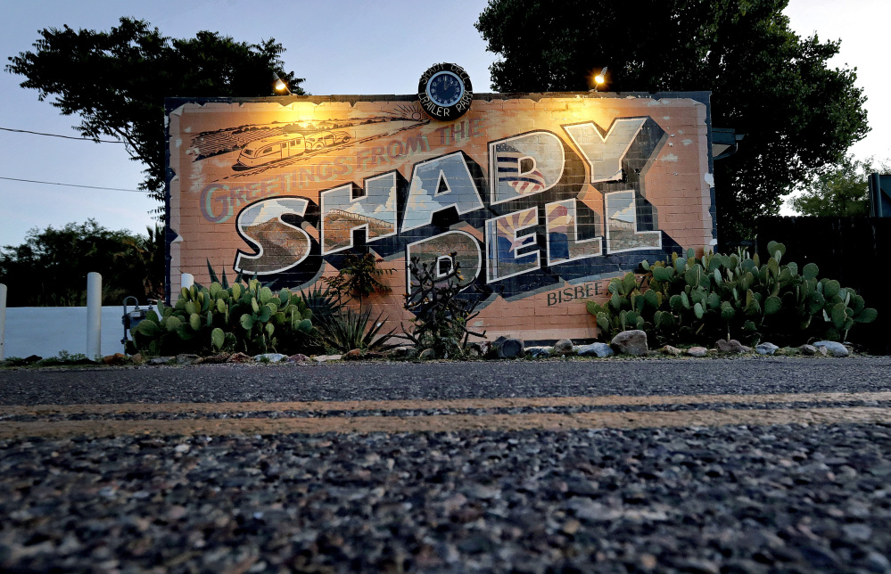 The front office of the Shady Dell trailer court is illuminated at dawn in Bisbee, Ariz., near Highway 80. The rest haven in the tiny mining town was a frequent stop for motorists during the golden age of American automobile travel.