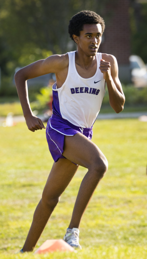 Deering senior Yahya Nure runs during an exhibition meet at Thornton Academy in Saco on Thursday. During a two-month visit to his native Ethiopia, he trained at high altitude but lost too much weight.