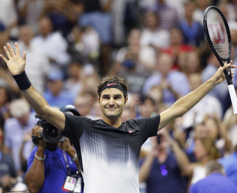 Roger Federer celebrates after his 6-4, 6-2, 7-5 win Monday night against Philipp Kohlschreiber, which kept him on track for a possible semifinal showdown against Rafael Nadal.