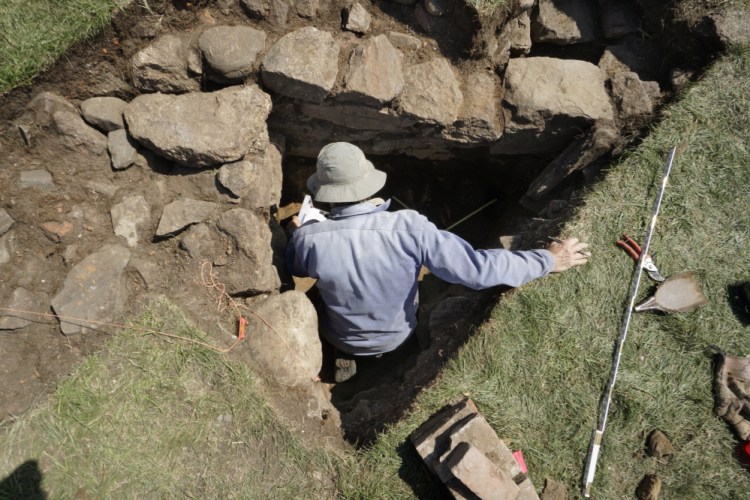 Archaeologist Kare Mathiasson records the details of a stone wall found during the dig in September 2017. One fortification built at the site, Fort William Henry, had stone walls 10 to 22 feet high.