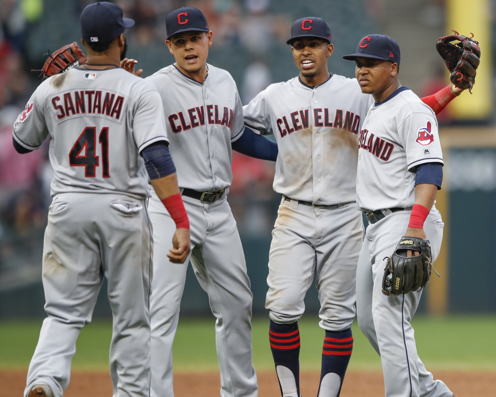Indians players celebrate Monday after their 12th consecutive victory – 5-3 against the Chicago White Sox.