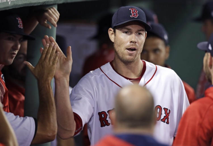 Doug Fister is congratulated by Red Sox teammates after being pulled during the eighth inning of a win against Cleveland on July 31 in Boston. After a bit of a rocky beginning, Fister now has a 3.61 ERA as a starter this season.