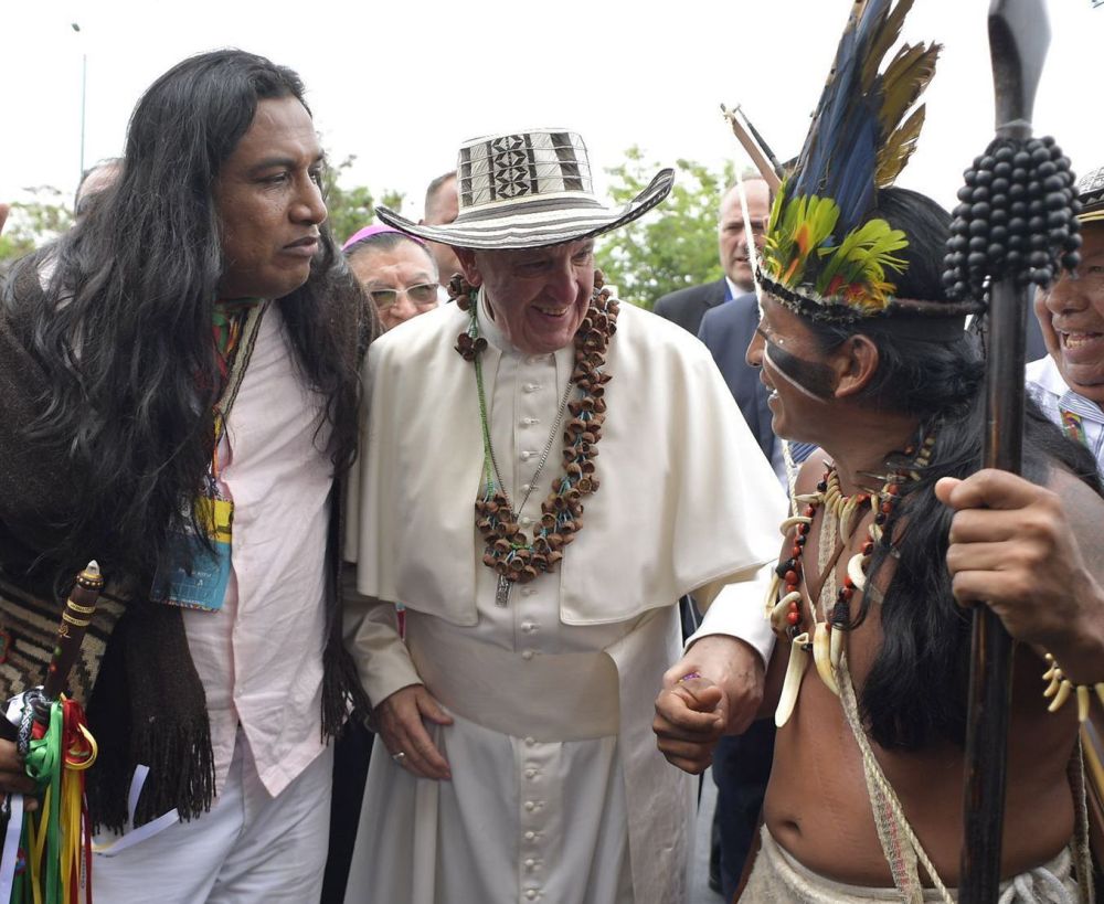 Representatives of Colombia's indigenous community pose with Francis in Villavicencio, Colombia, on Friday. Political violence left over 250,000 people dead and millions displaced.