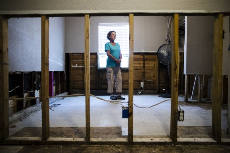 Julie Boon, director of Eudaimonia Recovery Homes poses for a photograph at her facility in Houston which was damaged by Hurricane Harvey. In the aftermath of flooded Houston, Boon oversaw repairs at a sober-living home while giving advice to residents based on her own 30 years of sobriety.