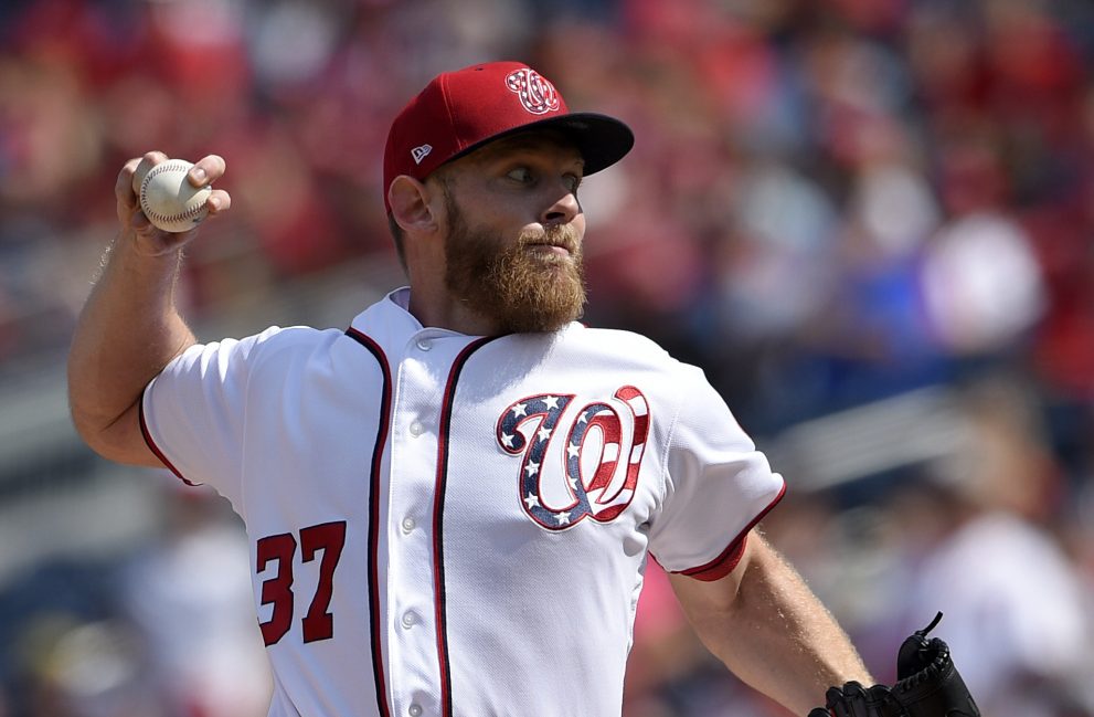 Stephen Strasburg extended his scoreless innings streak to 34 innings and the Nationals clinched the NL East title on Sunday in Washington.