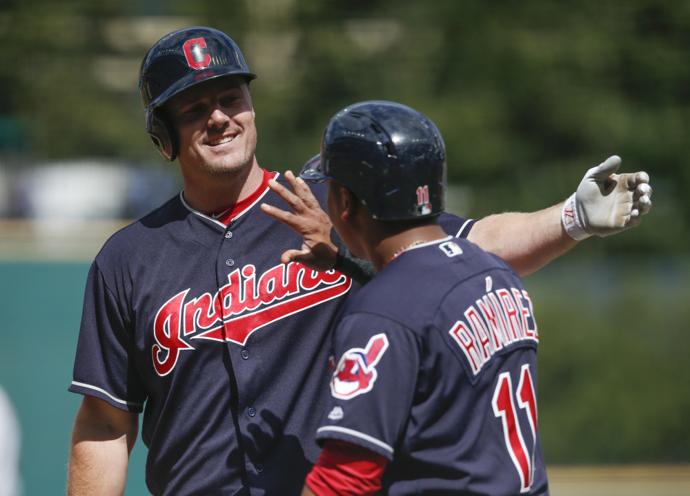 Cleveland Indians outfielder Jay Bruce celebrates with Jose Ramirez (11) after hitting a three-run home run off Detroit starting pitcher Buck Farmer during the first inning Wednesday in Cleveland.