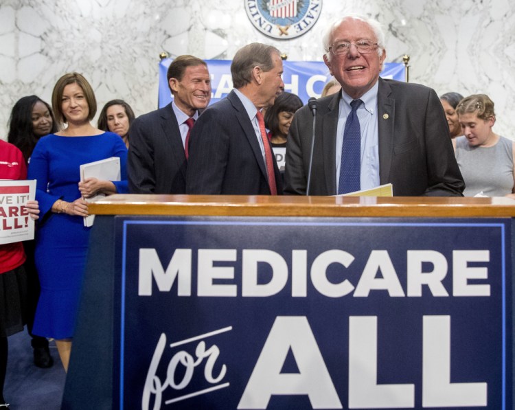 Backed by Democratic senators and liberal activists, Sen. Bernie Sanders unveils his proposal for a single-payer national health care system.