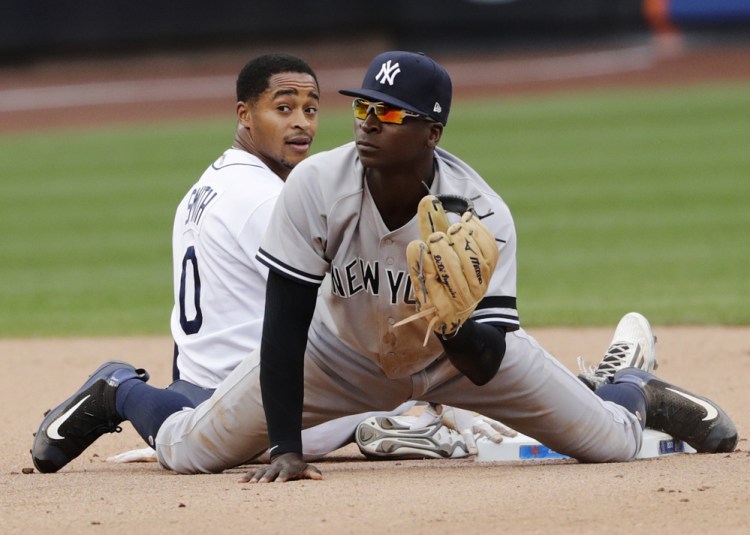 Tampa Bay's Mallex Smith, left, reacts after being forced out at second base by Yankees shortstop Didi Gregorius during the seventh inning Wednesday at the Mets' Citi Field in New York.