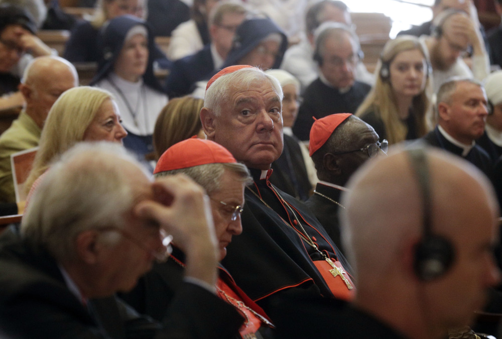 Cardinal Gerhard Ludwig Mueller, center, shown at a recent conference on the Latin Mass at the Pontifical University of St. Thomas Aquinas in Rome, was fired as Vatican doctrine chief.