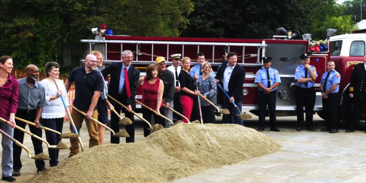Hallowell city officials and firefighters take part in a groundbreaking ceremony Friday for the planned new Hallowell fire station Friday at Stevens Commons.
