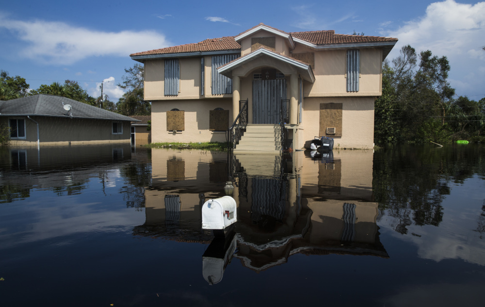 Flood waters touch the bottom of a mailbox in Bonita Springs on Florida's Gulf Coast, as the effects of Hurricane Irma continue to render parts of the state unlivable.