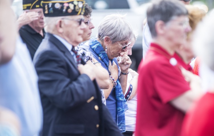 Norma Spurling, center, whose brother George Hout disappeared in 1944 on a flight from China to India, gets emotional Friday during an MIA memorial groundbreaking ceremony at the American Legion's Maine headquarters in Winslow.