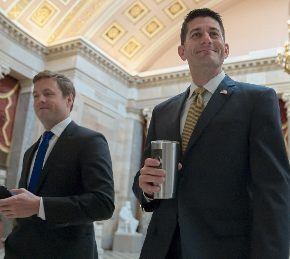 House Speaker Paul Ryan, R-Wis., right, wasn't invited to dine with the president Wednesday, but the top Democrats were.