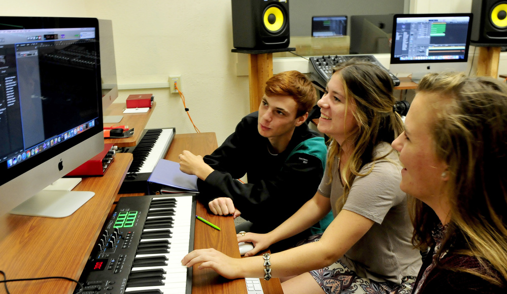 Maine Central Institute students confer on a music project in the Digital Music Production lab inside the new Visual & Performing Arts Education Center at the Pittsfield school. From left are T.J. Stewart, Allison Hughes and Sarah Welch.