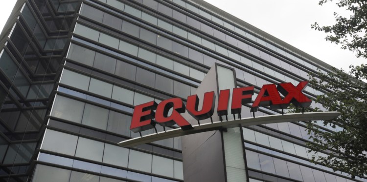 Photo shows Equifax Inc. offices in Atlanta. A Justice Department investigation will focus on whether top officials at Equifax violated insider trading laws when they sold stock before the company disclosed it had been hacked.