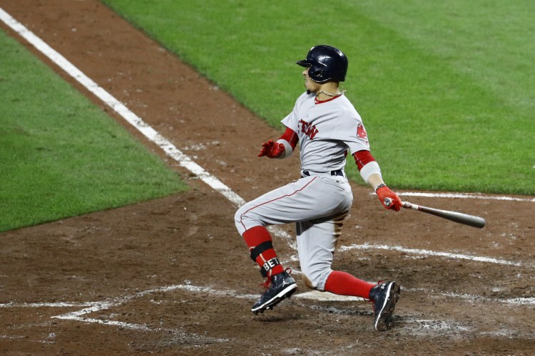 Mookie Betts hits a three-run double in the fifth inning, in which the Red Sox scored six runs to take a 7-6 lead. Xander Bogaerts, Brock Holt and Andrew Benintendi scored on the play.