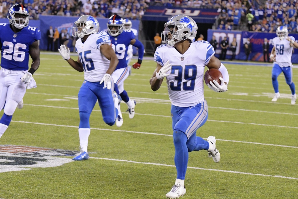 Jamal Agnew returns a punt for a touchdown for the Lions in the second half of their road win over the New York Giants.