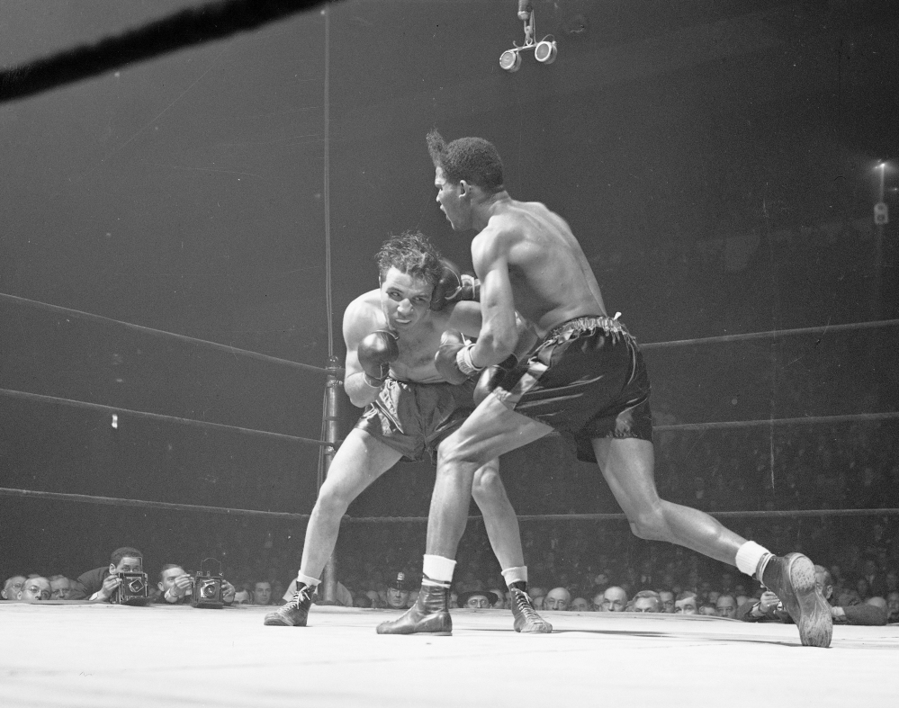 Jake LaMotta, left, and Ray Robinson fight at Madison Square Garden in New York. in 1945. 