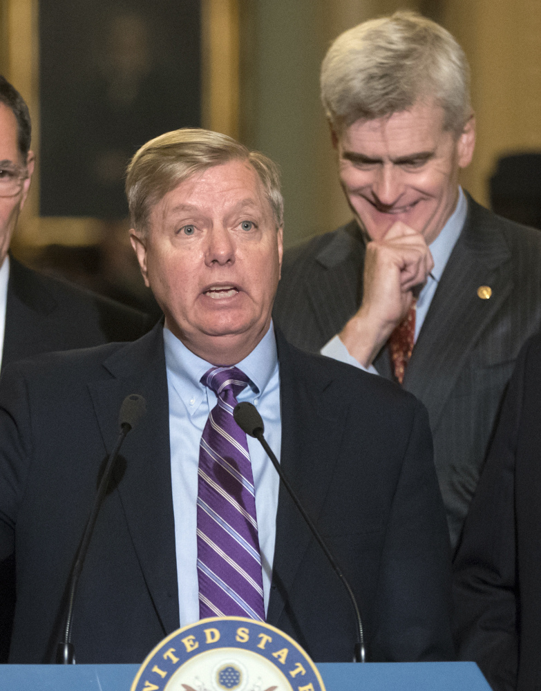 Sens. Lindsey Graham, left, and Bill Cassidy are pushing a last-ditch effort  to uproot the Affordable Care Act.