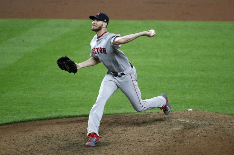 Boston Red Sox starting pitcher Chris Sale throws to the Baltimore Orioles in the eighth inning of a baseball game in Baltimore, Wednesday, Sept. 20, 2017. Sale threw his 13th strikeout in the eighth to become the first AL pitcher in 18 years to reach the 300 mark. Boston won 9-0.