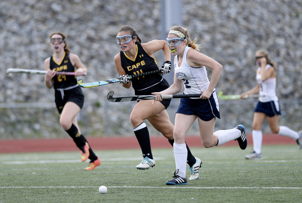 Isabelle King of Yarmouth chases the ball down the field ahead of Katie Beth Dunham of Cape Elizabeth during Yarmouth's 4-1 victory Wednesday in a Western Maine Conference field hockey game at Yarmouth High.