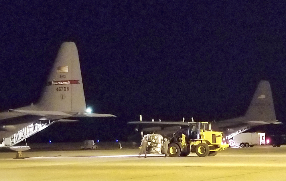 Seven members of a specialized Maine Air National Guard communications team left for the U.S. Virgin Islands on Thursday to assist recovery efforts after hurricanes Irma and Maria battered the region. A trailer is backed onto a plane bound for St. Croix.