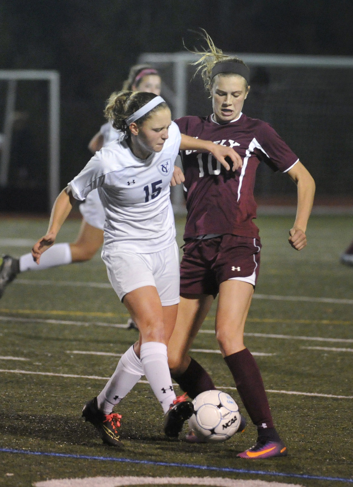 Yarmouth and Greely High soccer players vie for control of the ball during a 2016 game. An ACL injury prevention program that started with Yarmouth's youth and high school girls' soccer teams has been expanded to include all Yarmouth High soccer players.