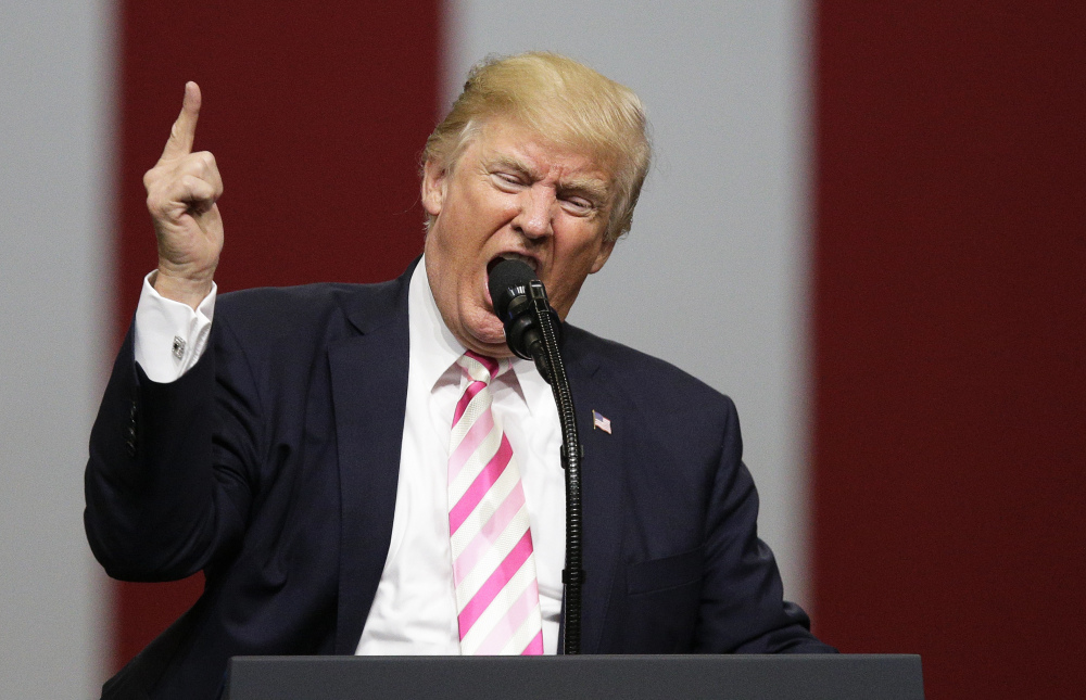 President Trump makes remarks about NFL players and the American flag at a campaign rally in support of Republican Sen. Luther Strange in Huntsville, Ala., on Friday night.