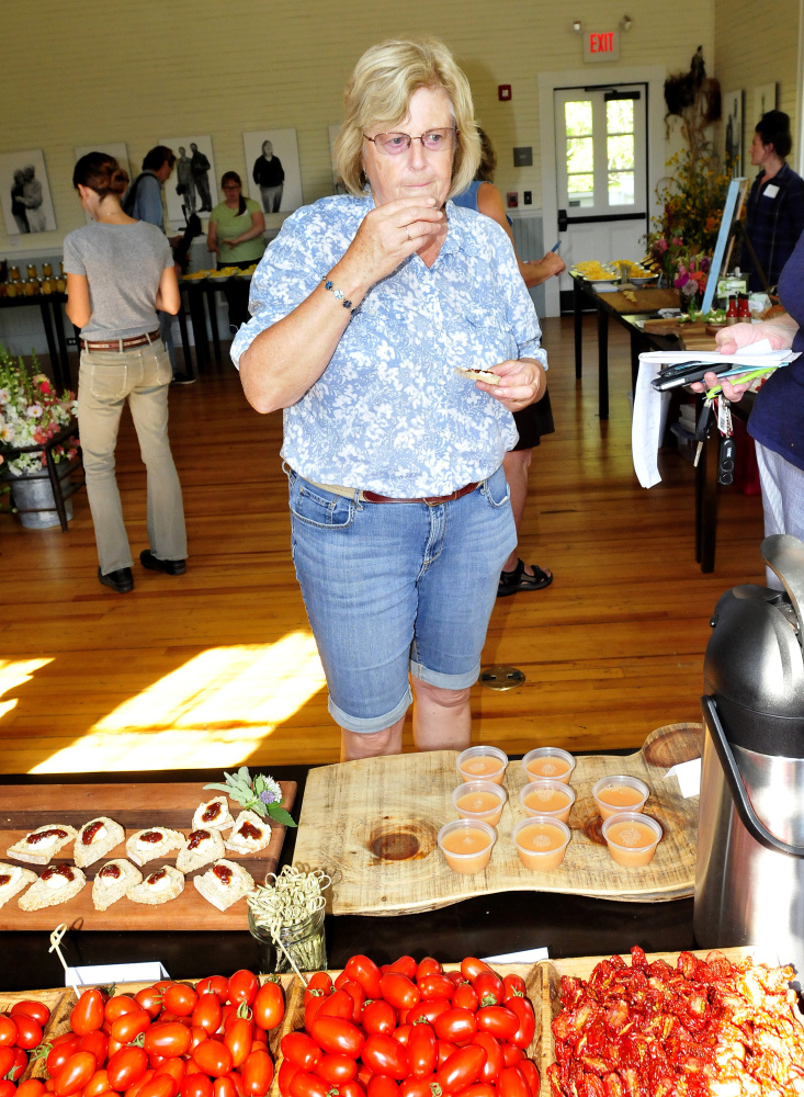 Audrey Bemis of Harmony samples tomato dishes at the Seed to Table Variety Tasting at the Unity Food Hub on Sunday. 