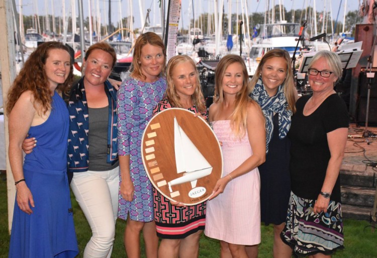 Members of the Sea Bags women's sailing team based in Portland pose with their trophy after placing first among the three all-women's teams at the J/24 world sailing championships last week on Lake Ontario. From left are Jessica Harris, Charlotte Kinkade, Karen Fallon, Erica Beck Spencer, Hillary Noble, Katie Drake and Joy Martin.