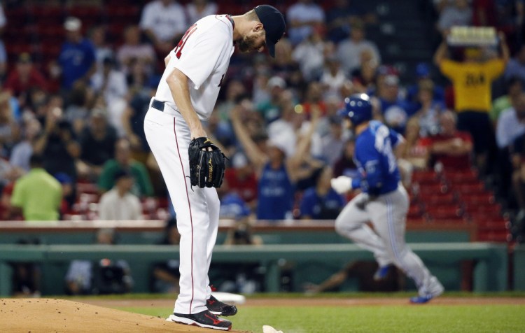 Boston's Chris Sale did not have a good night against the Blue Jays on Tuesday at Fenway Park. He allowed four home runs, including a first-inning homer to Josh Donaldson. Sale was lifted after five innings and dropped to 17-8.