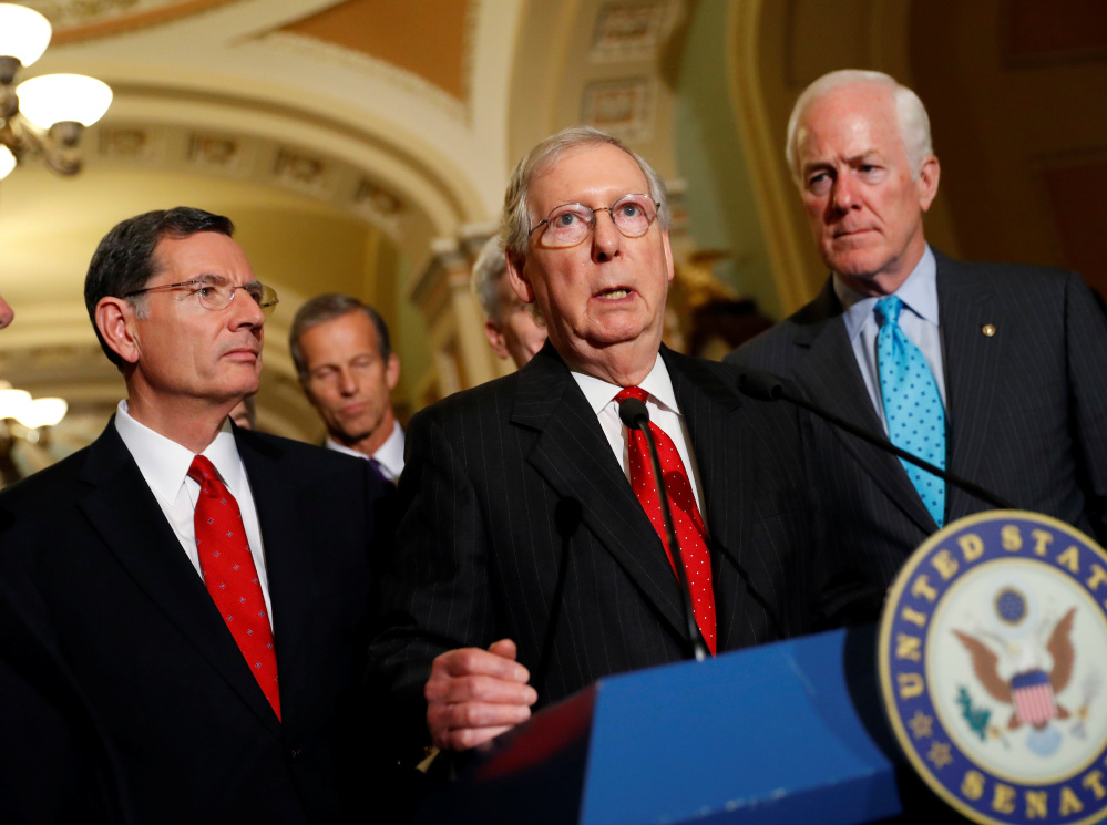 Senate Majority Leader Mitch McConnell (Ky.), accompanied by, from left, Republican Sens. John Barrasso (Wy.) and John Cornyn (Texas), speaks with reporters following the party luncheons on Capitol Hill in Washington, D.C., Tuesday, prior to the Alabama Senate primary results.
