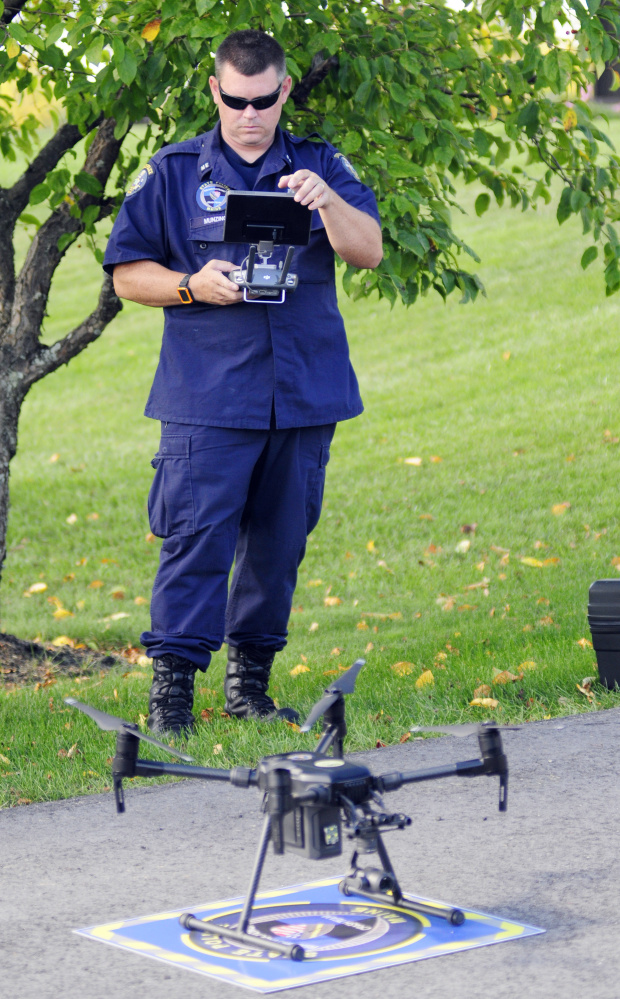 Maine State Police Specialist Patrick Munzing prepares to launch an unmanned aerial vehicle Thursday outside state police headquarters in Augusta.