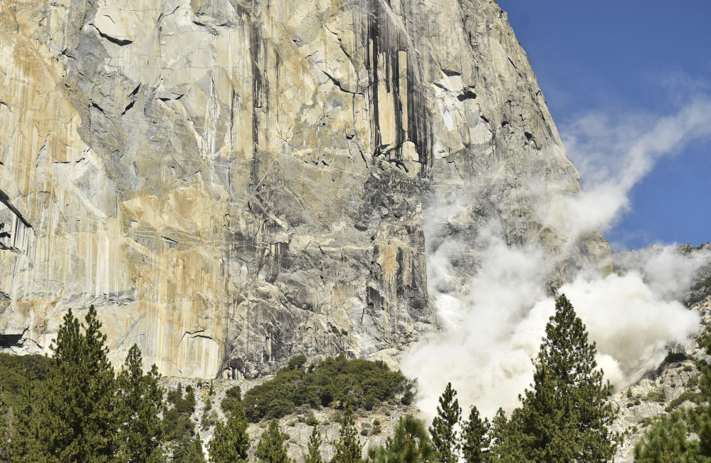 A cloud of dust rises Wednesday after a rock fall at El Capitan in Yosemite National Park, Calif. An official said one British climber was killed and another was seriously injured.