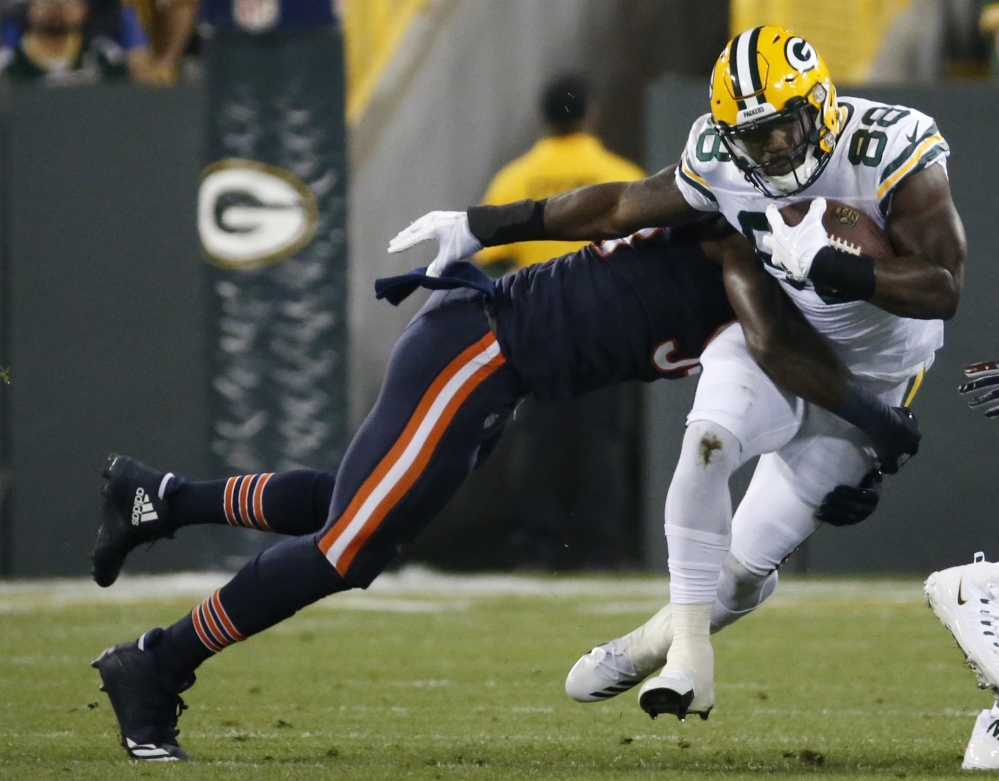 Green Bay's Ty Montgomery is hit by Chicago's Leonard Floyd in the first half Thursday night in Green Bay. Montgomery left the game in the first quarter with a chest injury.