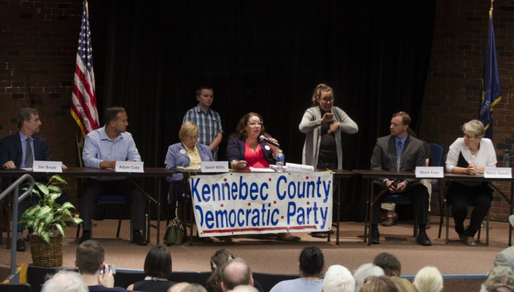 Democratic candidates for governor participate in a forum Thursday night at the University of Maine of Augusta. From left are candidates Jim Boyle, Adam Cote, Janet Mills and Diane Russell; sign language interpreter Paula Matlins; and candidates Mark Eves and Betsy Sweet. More than 120 people attended the event.