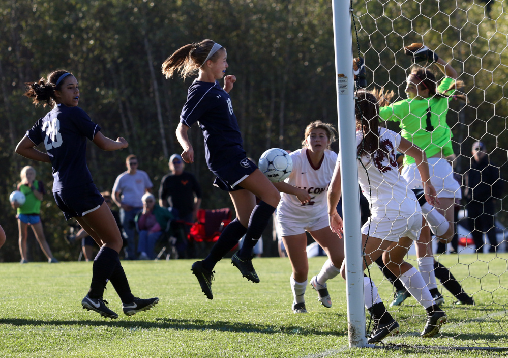 Ashlyn Feeley of Yarmouth uses her knee to get the ball into the goal Friday during a 6-0 victory against Freeport in a Western Maine Conference girls' soccer game at Freeport High.