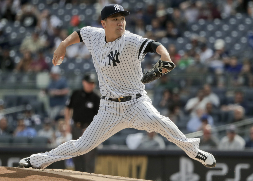 Masahiro Tanaka set a career high with 15 strikeouts and the Yankees stayed in the AL East hunt with a 4-0 victory over the Toronto Blue Jays on Friday in New York.