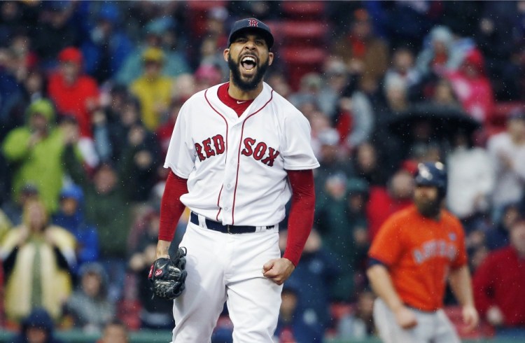 David Price of the Red Sox reacts after striking out Houston's George Springer to retire the side with the bases loaded in the seventh inning Saturday in Boston. Boston beat Houston, 6-3, to clinch their second straight American League East title.