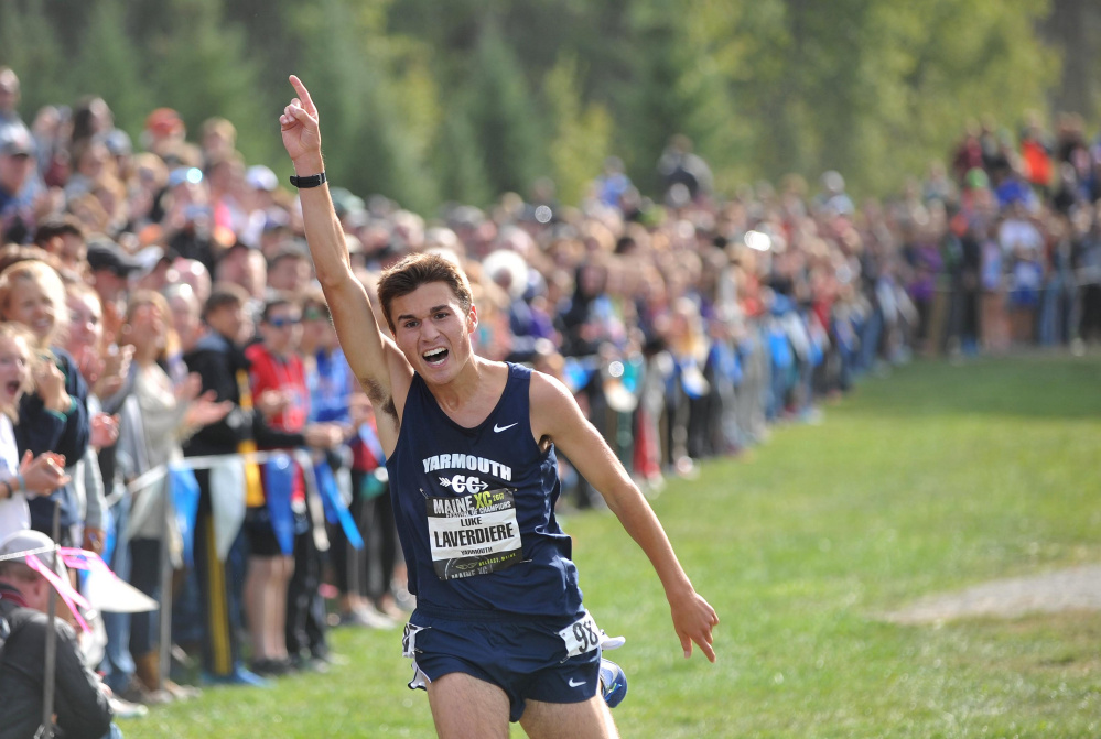 Yarmouth High senior Luke Laverdiere celebrates his first-place finish a the tMaine XC Festival of Champions in Belfast on Saturday.  Laverdiere was just four seconds off the course record. (Staff photo by Michael G. Seamans)
