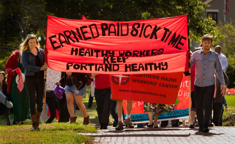People walk up State Street on Labor Day to launch a campaign for earned sick time in Portland.