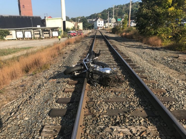 The front end of Breanne Hewins' motorcycle lies on railroad tracks after it was split in two hitting a utility pole.